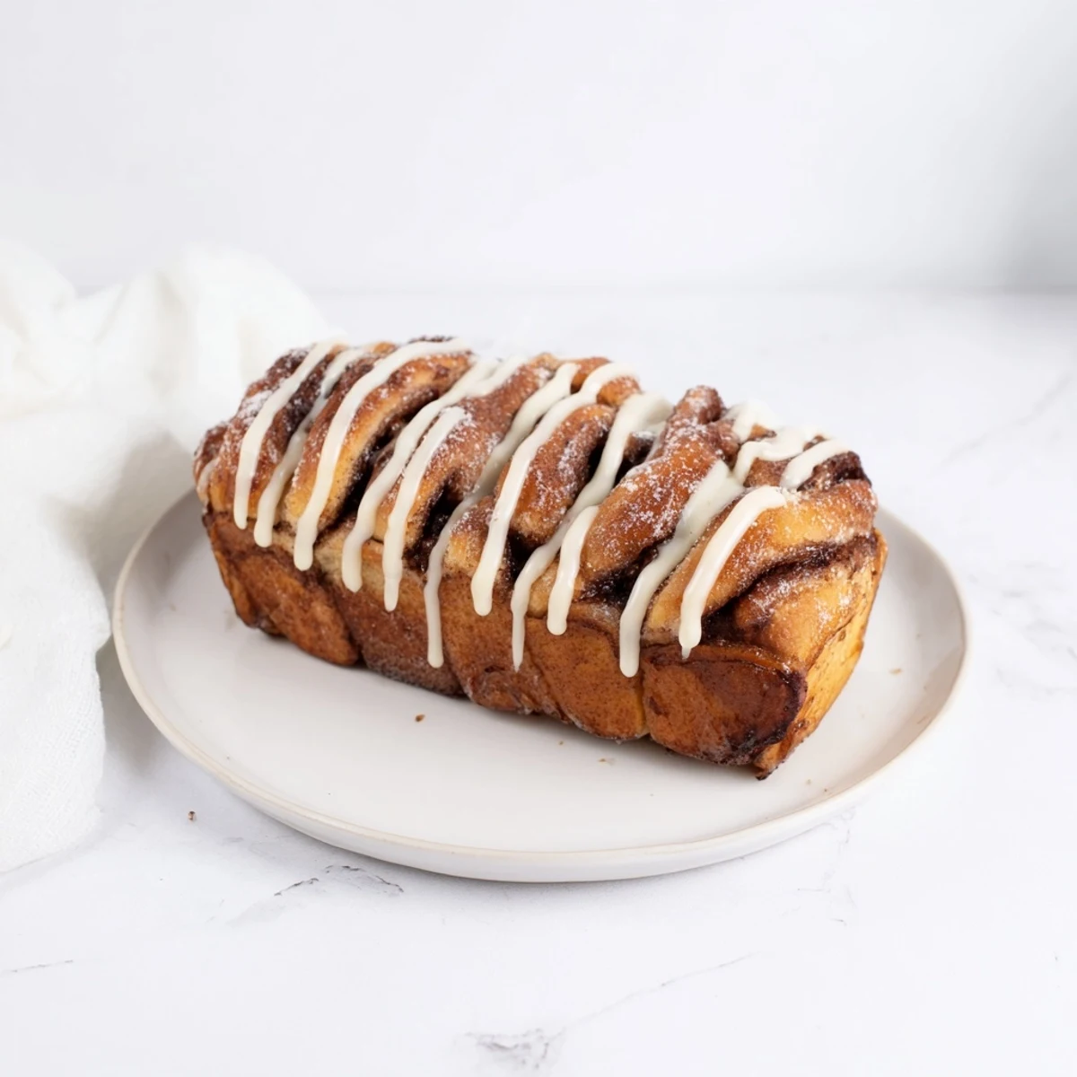 Warm, golden Cinnamon Swirl Christmas Tree Bread, showcasing a delicious cinnamon-sugar filling ready to serve.