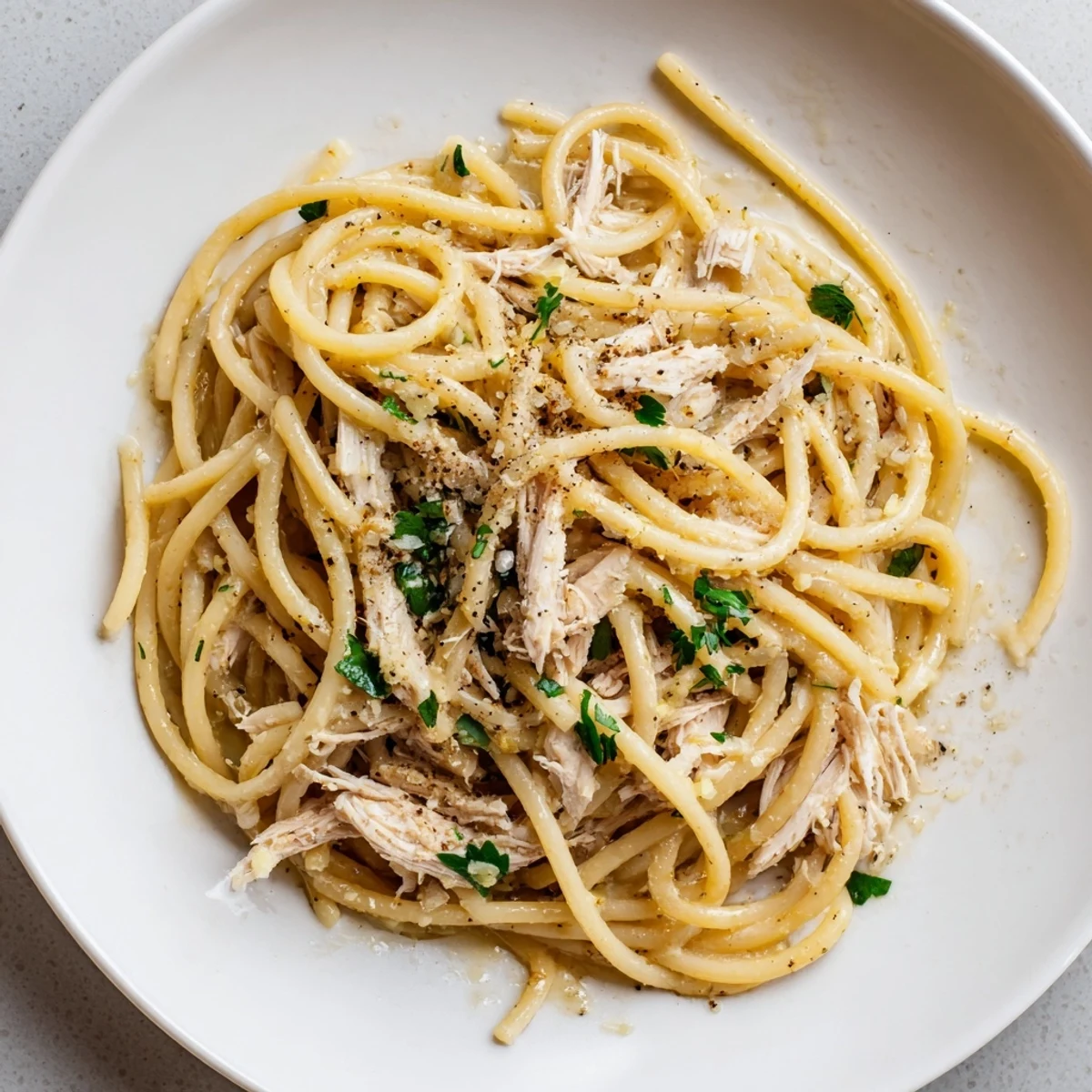 Golden garlic butter coats bucatini in this Simple Garlic Butter Bucatini, topped with tender chicken.