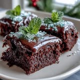 Shamrock-shaped brownies with rich chocolate and vibrant green icing, perfect for festive St. Patrick's Day celebrations.