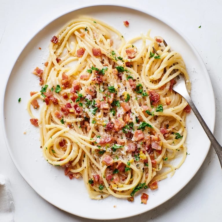 Crispy Bacon Linguine served hot, garnished with fresh parsley and lemon zest for brightness.