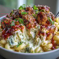 Creamy cheddar macaroni and cheese topped with Korean-style turkey crumbles and fresh scallions for a fusion dinner.