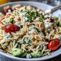 Vibrant Orzo Salad with Cucumber, Feta, and bright lemon dressing photo.